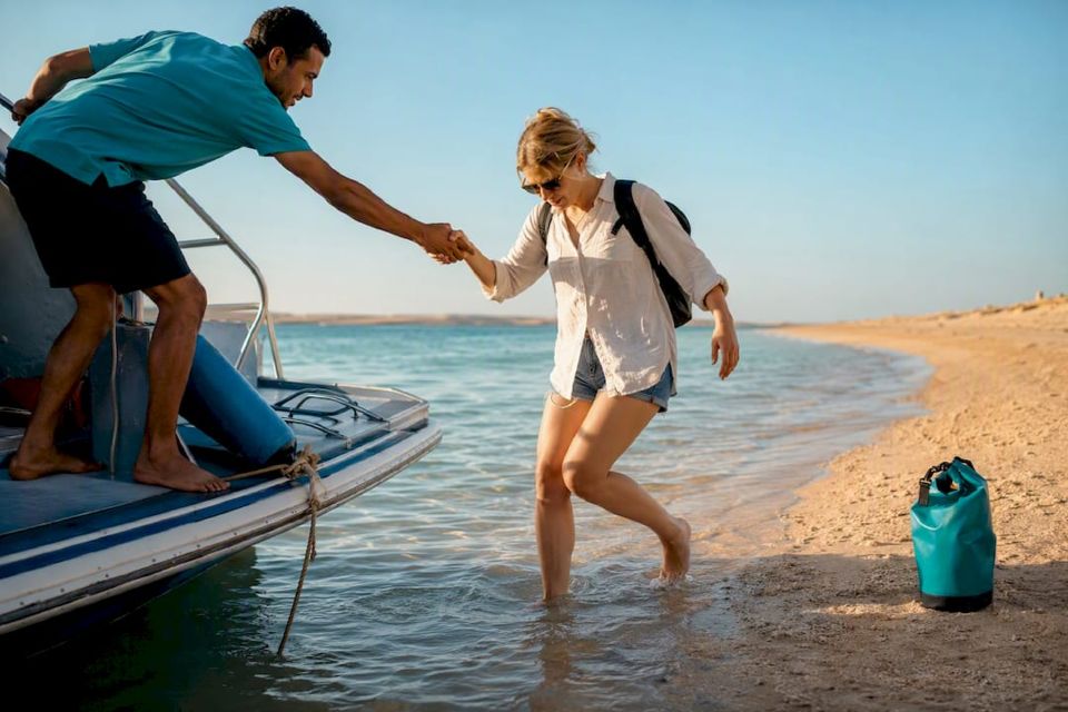 Traveler stepping ashore at Giftun beach