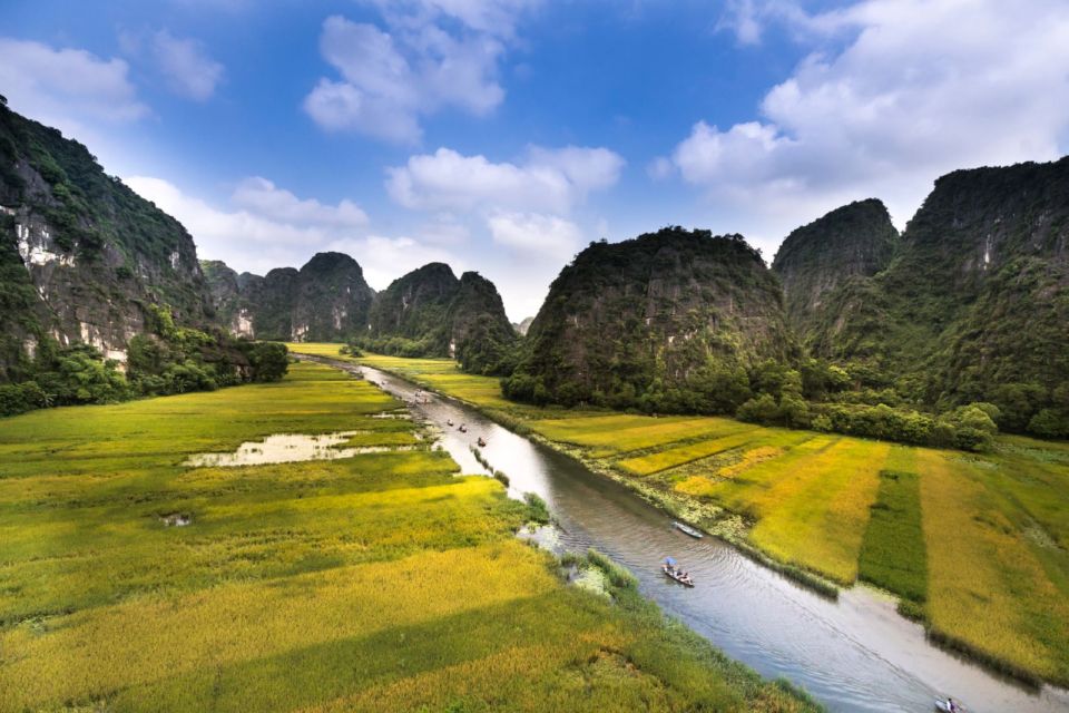 Trang An's river winds through rice fields and karst mountains in Ninh Binh