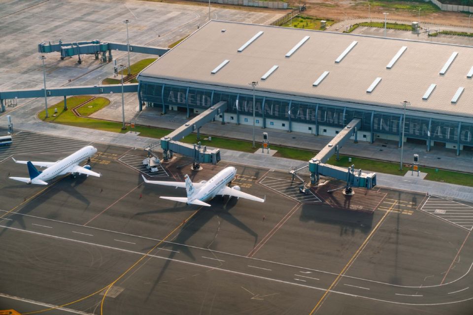 Aerial view of Abeid Amani Karume International Airport in Zanzibar with planes parked at the terminal.