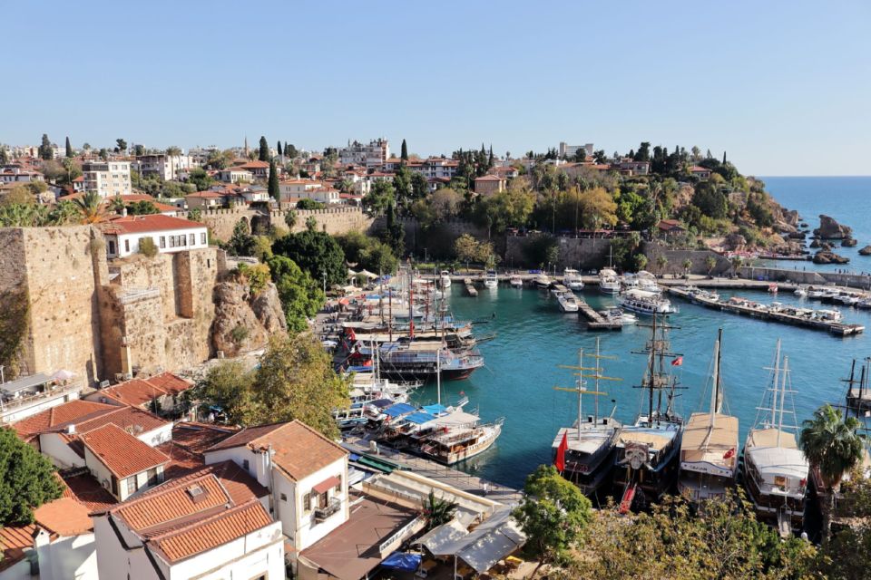 Antalya's old harbour seen from above, with boats moored below the historic town walls.