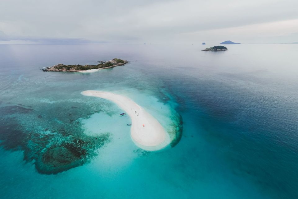Aerial view of a white sandbar and small islands in clear water near Orange Bay, Hurghada.